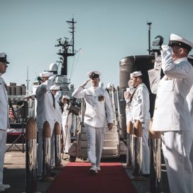 military personnel saluting