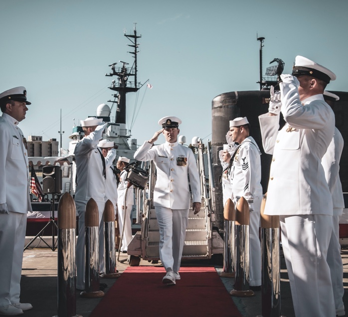 military personnel saluting